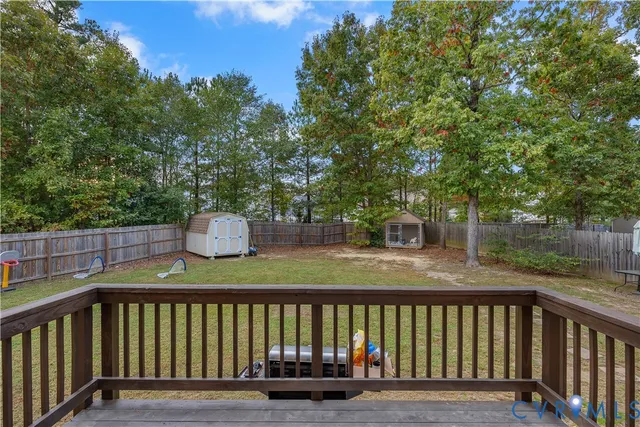 a view of a two chairs on the deck