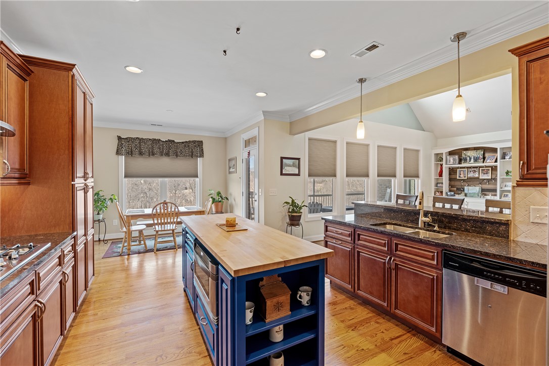 119 Turnberry Road Anderson, SC 29621 - Photo 17 of 50 This spacious kitchen features ample counter space, rich wood cabinetry, and a bright, open layout.