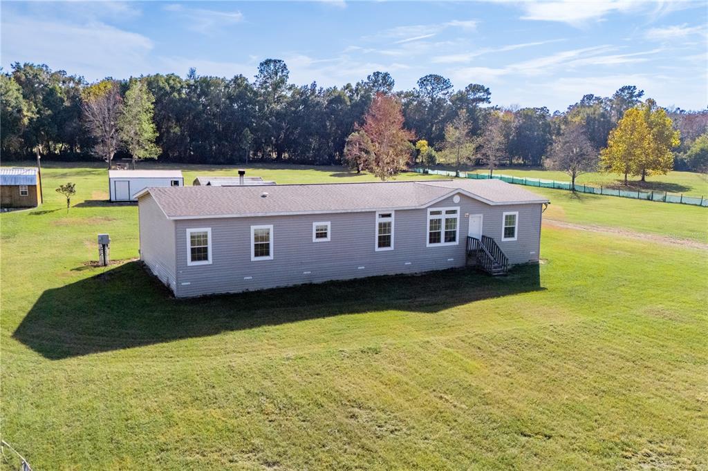 129 Perry Road, Unit 1 Hawthorne, FL 32640 - Photo 46 of 58 a view of a house with a big yard
