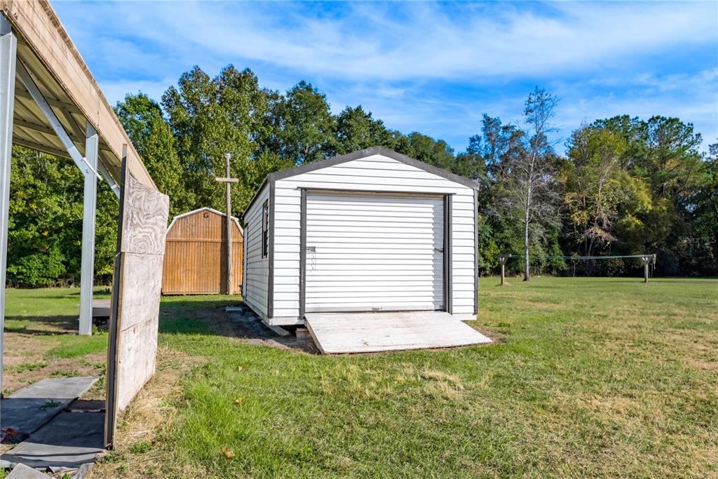 129 Perry Road, Unit 1 Hawthorne, FL 32640 - Photo 49 of 58 a front view of a house with a yard