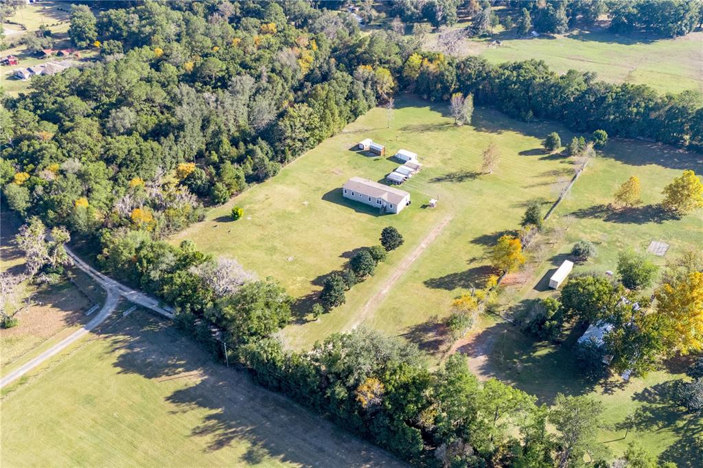 129 Perry Road, Unit 1 Hawthorne, FL 32640 - Photo 57 of 58 a view of a swimming pool with a yard