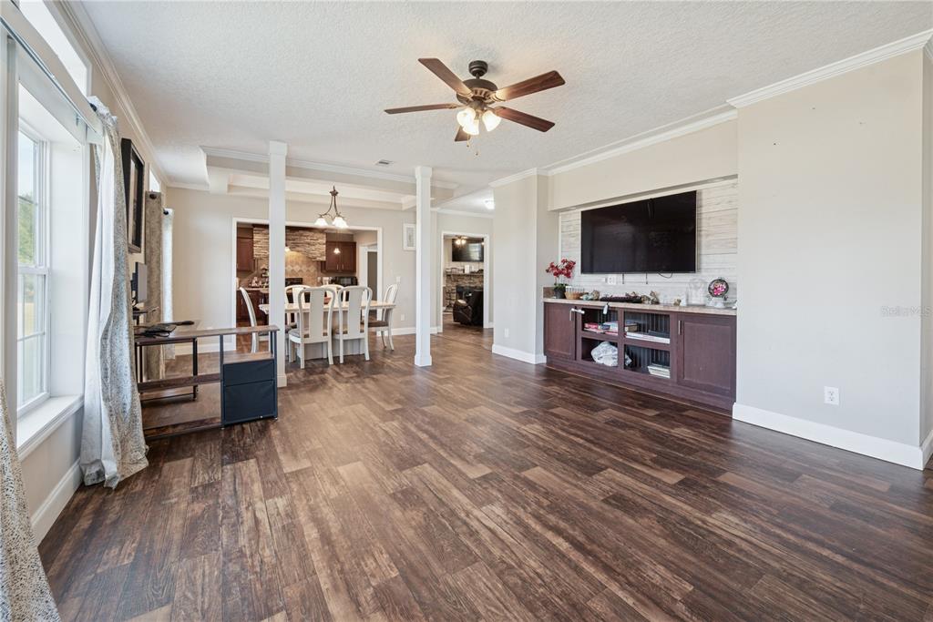 129 Perry Road, Unit 1 Hawthorne, FL 32640 - Photo 6 of 58 a living room with furniture and a flat screen tv