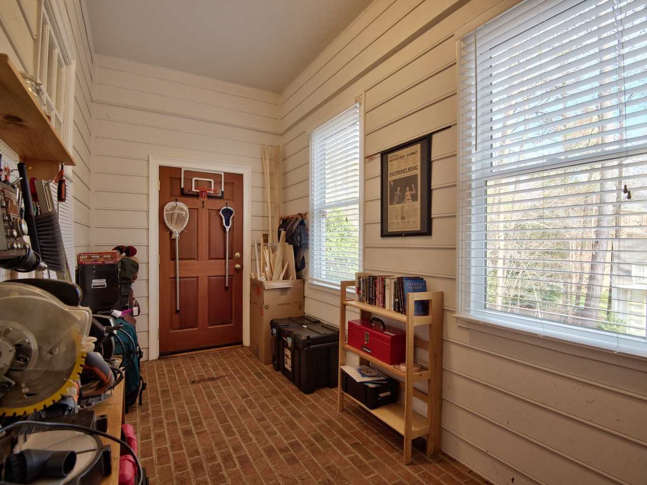 3809 Chippenham Road Durham, NC 27707 - Photo 10 of 23 Brick floor anchors side entry from driveway and is great for easy drop zone or more options. Mud Room