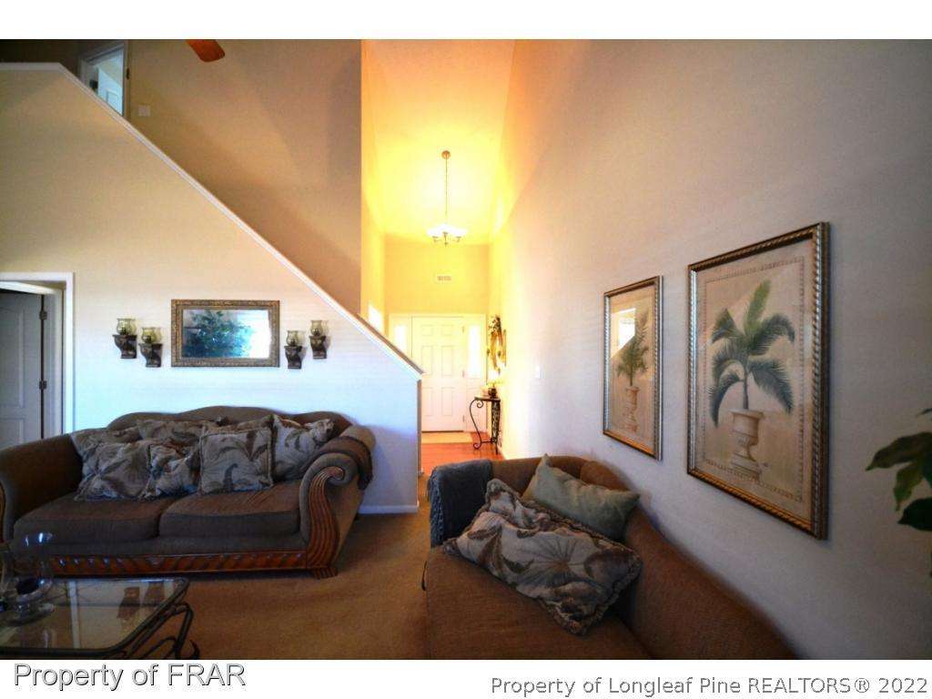 645 Cape Fear Road Raeford, NC 28376 - Photo 6 of 24 a living room with furniture and a painting on the wall