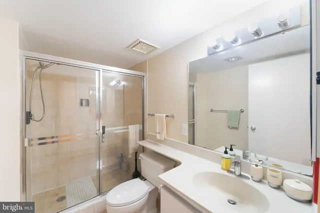 a view of an empty room and a window