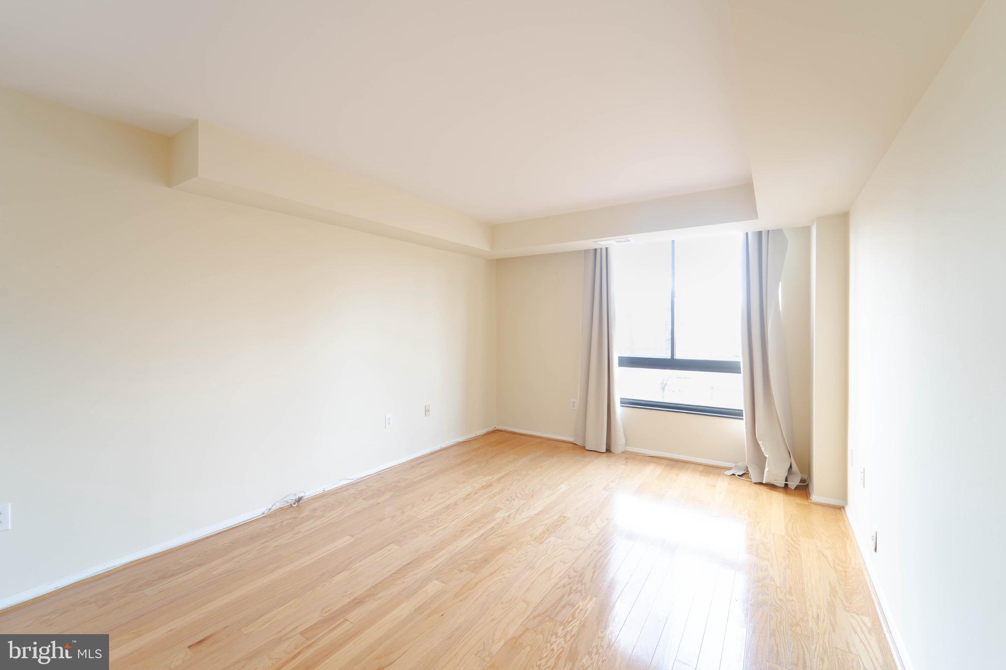 1808 Old Meadow Road, Unit 805 McLean, VA 22102 - Photo 18 of 58 a view of an empty room and a window