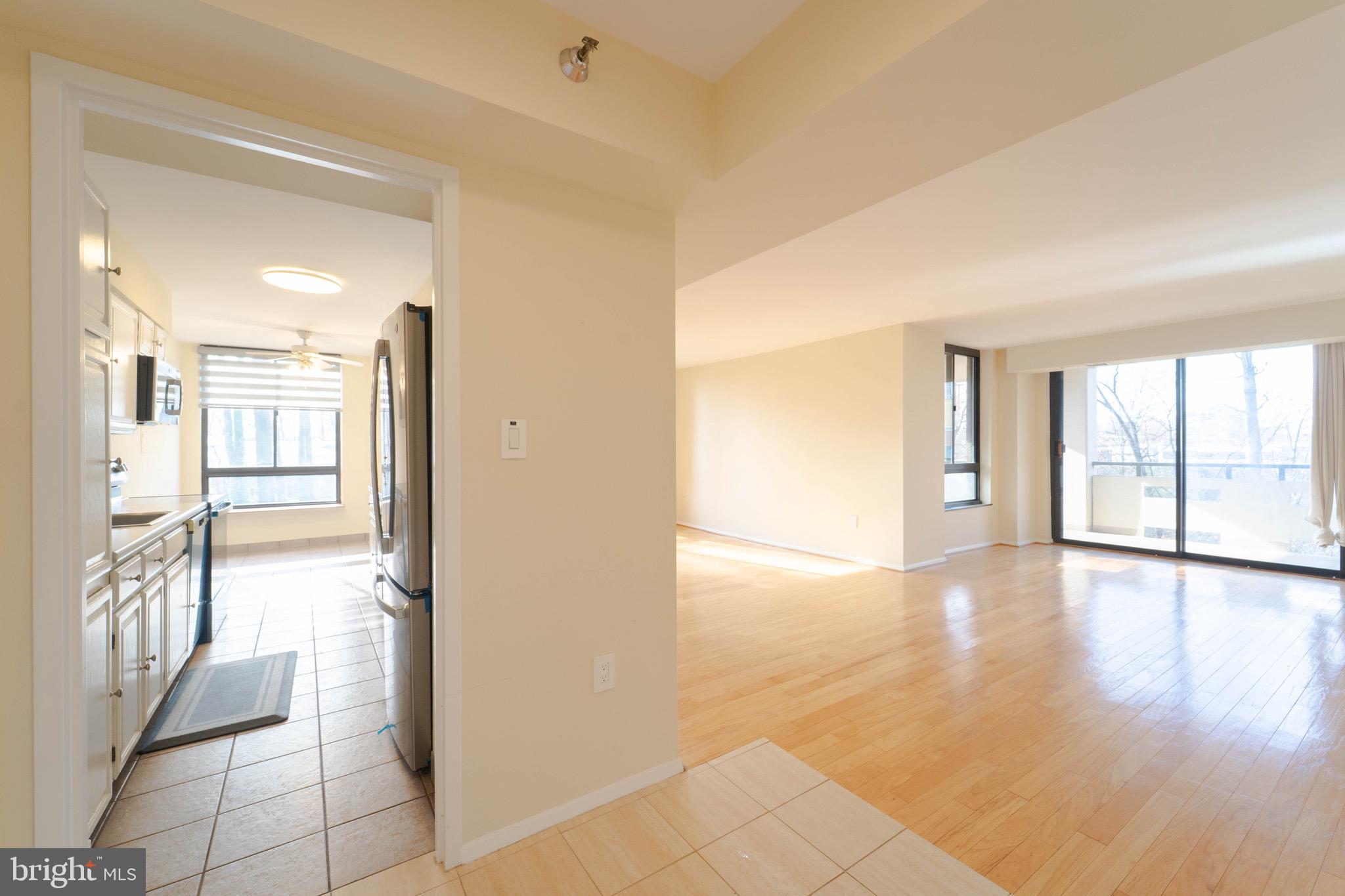 1808 Old Meadow Road, Unit 805 McLean, VA 22102 - Photo 2 of 58 a view of a hallway with wooden floor and a bathroom