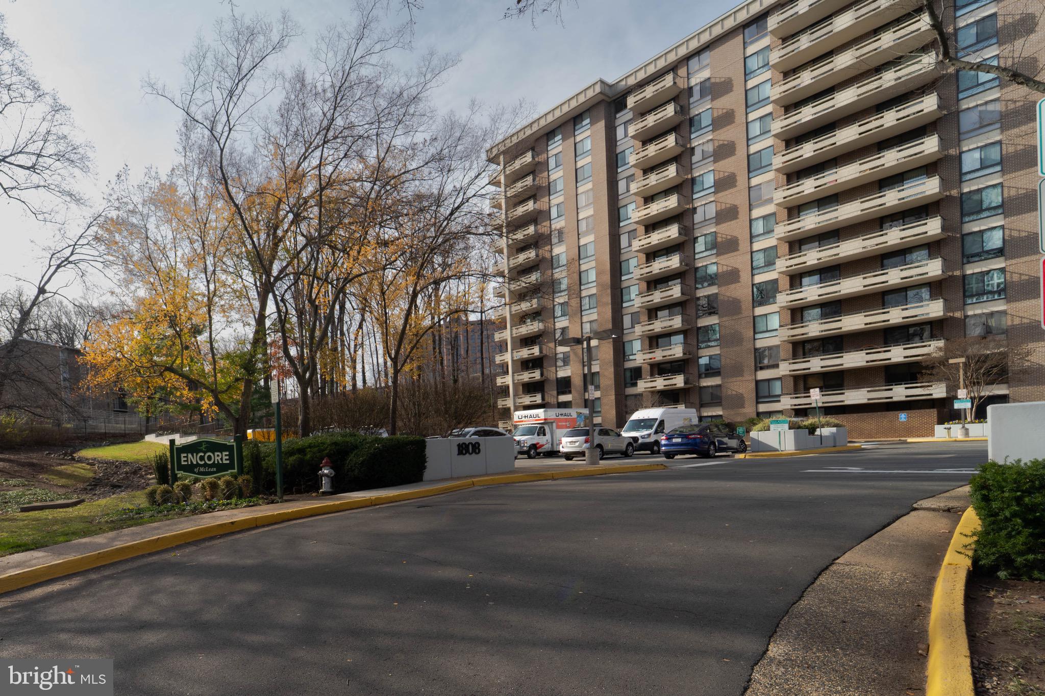 1808 Old Meadow Road, Unit 805 McLean, VA 22102 - Photo 32 of 58 a city street lined with buildings and trees