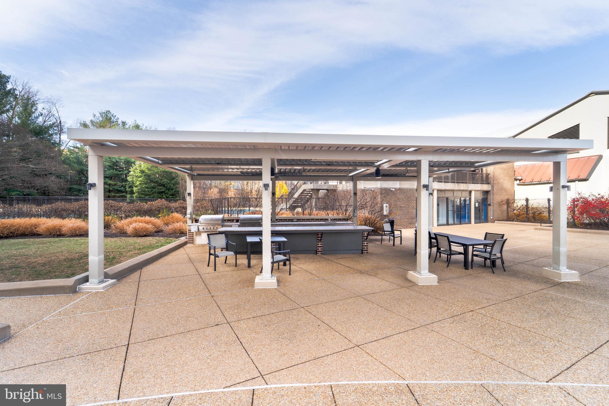 1808 Old Meadow Road, Unit 805 McLean, VA 22102 - Photo 38 of 58 a view of a chairs and table in a patio