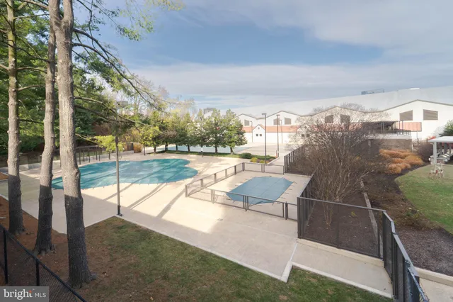 a living room with a flat screen tv and a dining table