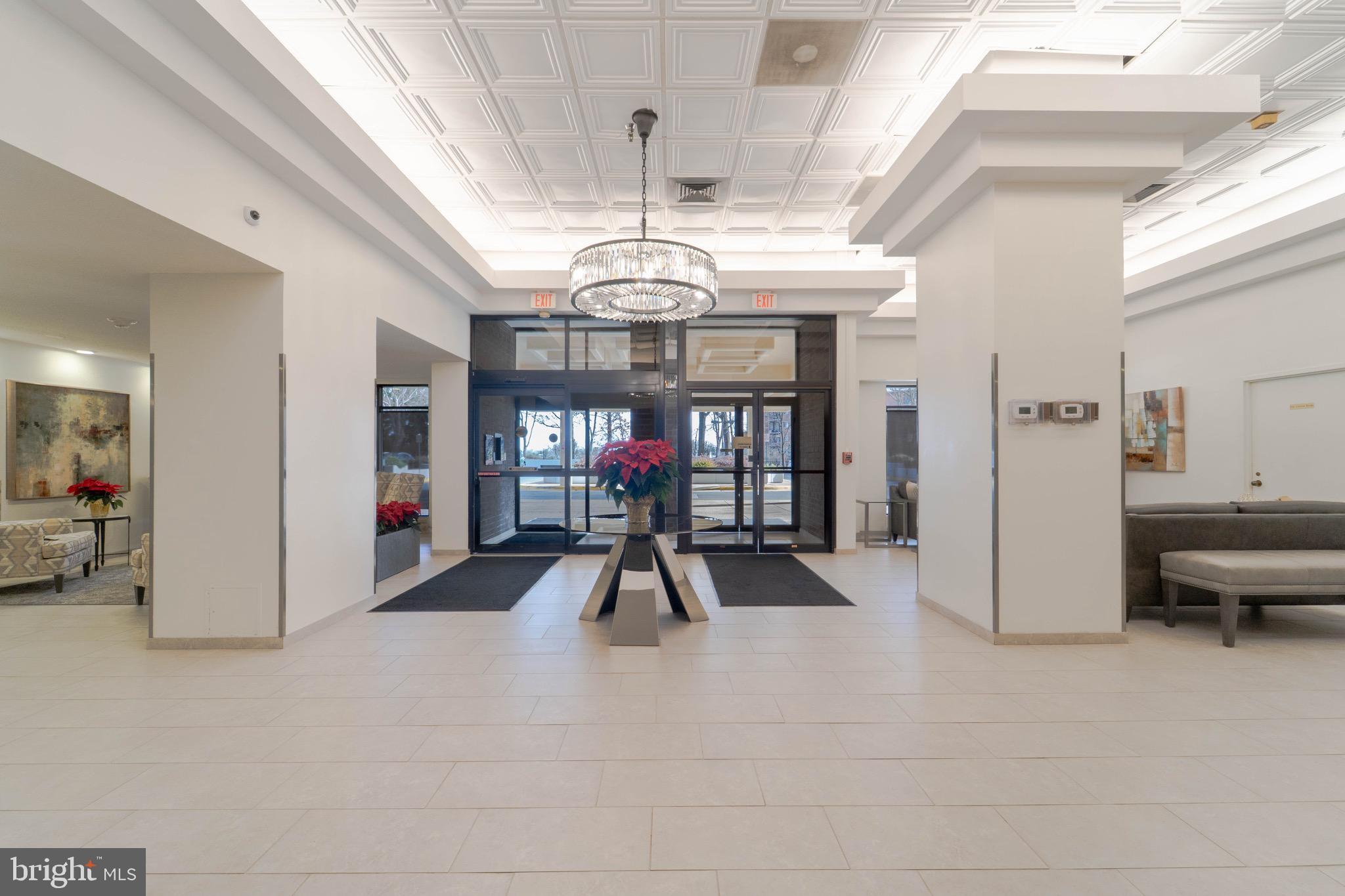 1808 Old Meadow Road, Unit 805 McLean, VA 22102 - Photo 43 of 58 a view of a livingroom with furniture and a chandelier