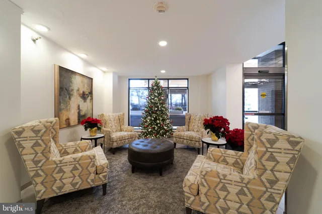 a living room with furniture and a lamp