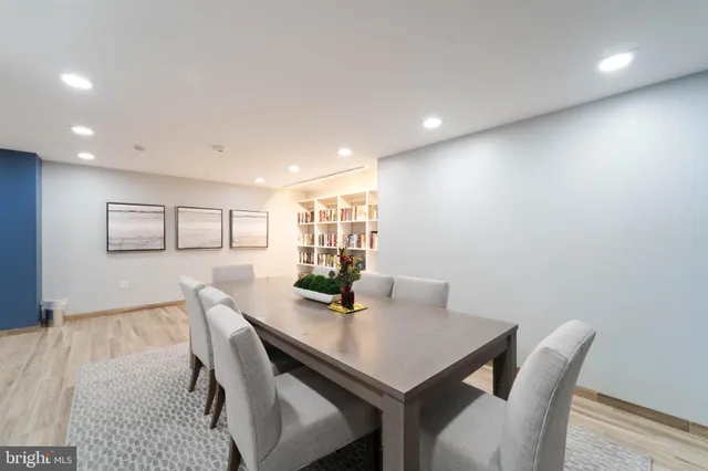 a room with gym equipment and a table