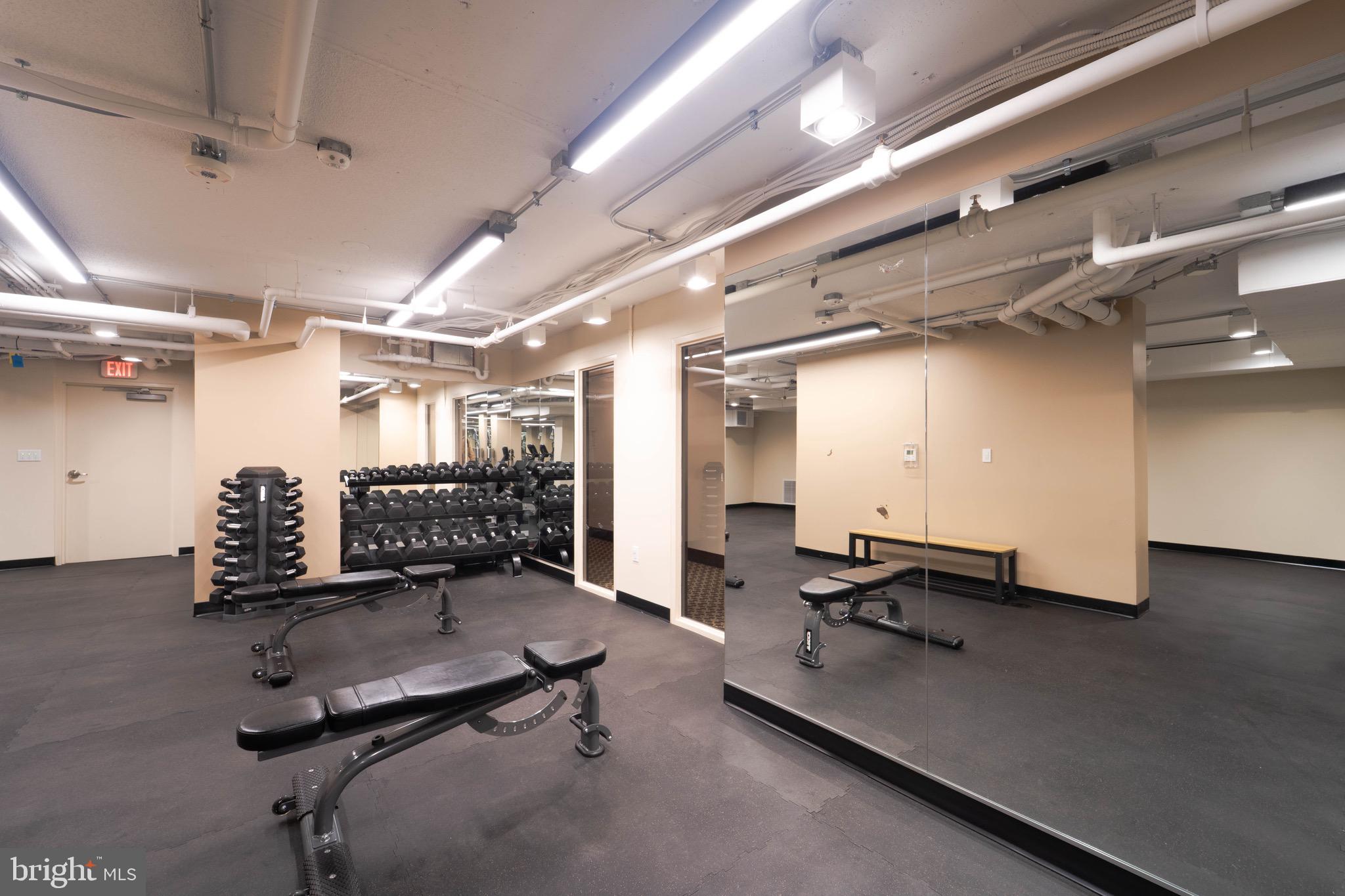 1808 Old Meadow Road, Unit 805 McLean, VA 22102 - Photo 57 of 58 a room with gym equipment and a table