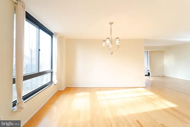 a view of a room with window and wooden floor
