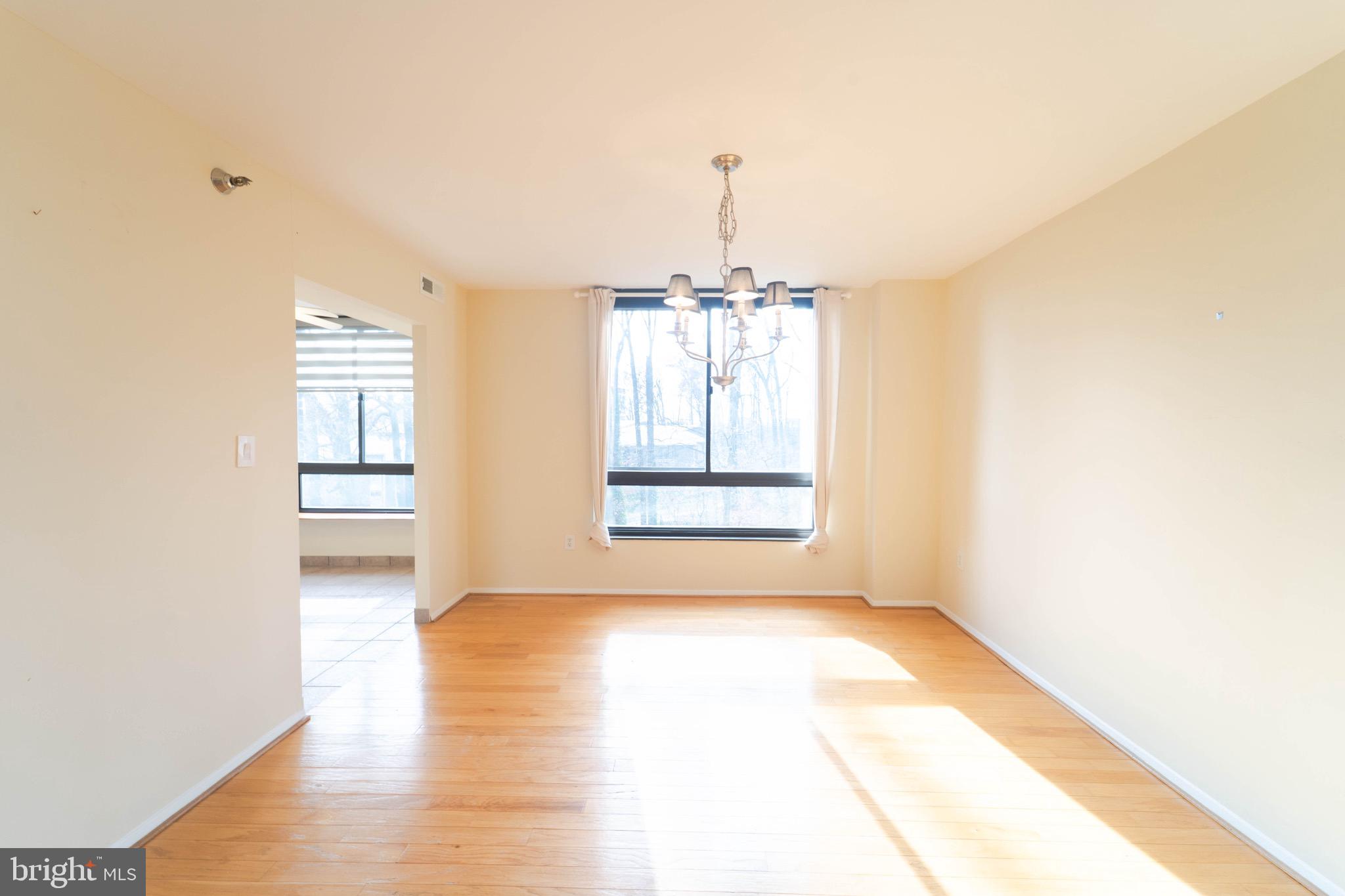1808 Old Meadow Road, Unit 805 McLean, VA 22102 - Photo 10 of 58 a view of a room with window and wooden floor