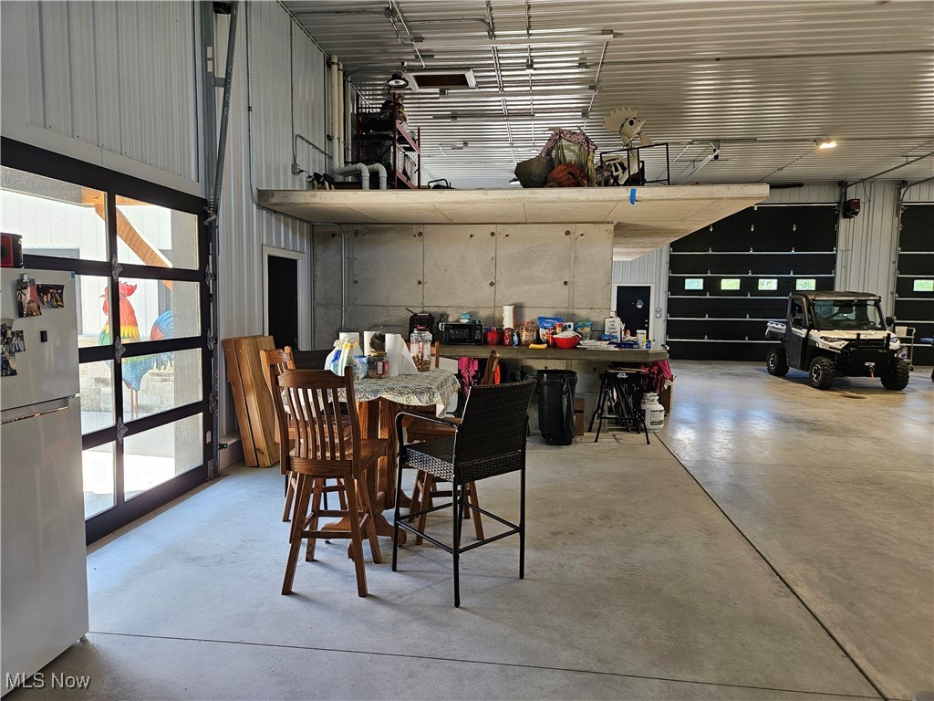 1180 North County Line Road Geneva, OH 44041 - Photo 13 of 33 Dining space featuring concrete floors