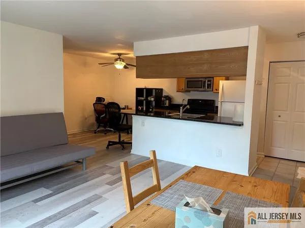 a bedroom with furniture and a wooden floor