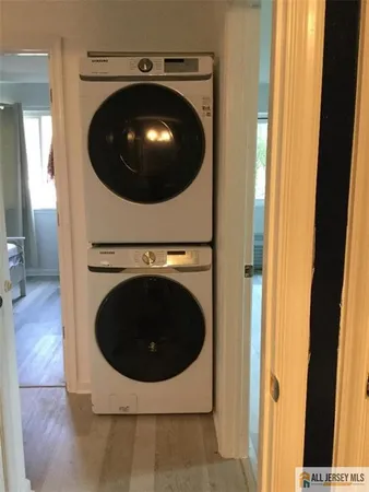 a living room with a washer and dryer