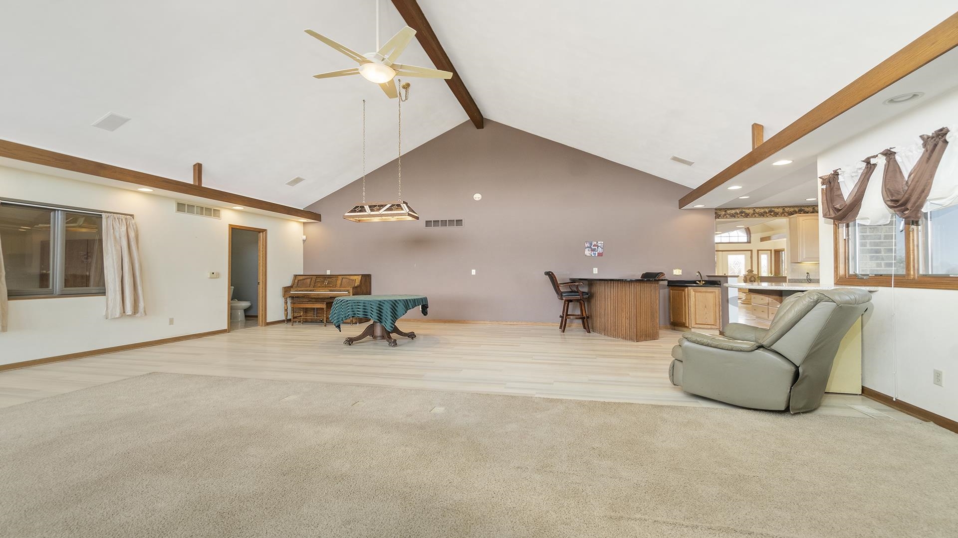 7674 West Pines Road Polo, IL 61064 - Photo 18 of 60 a view of a livingroom with furniture and a ceiling fan