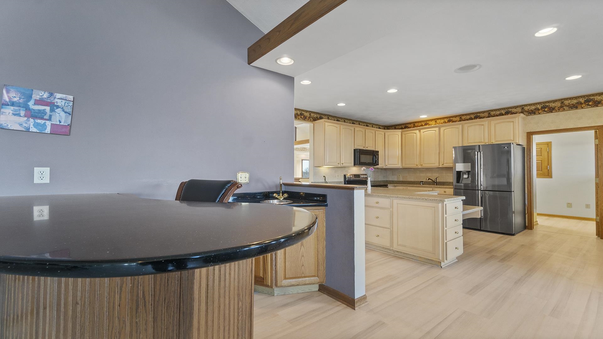 7674 West Pines Road Polo, IL 61064 - Photo 26 of 60 a kitchen with refrigerator and chairs