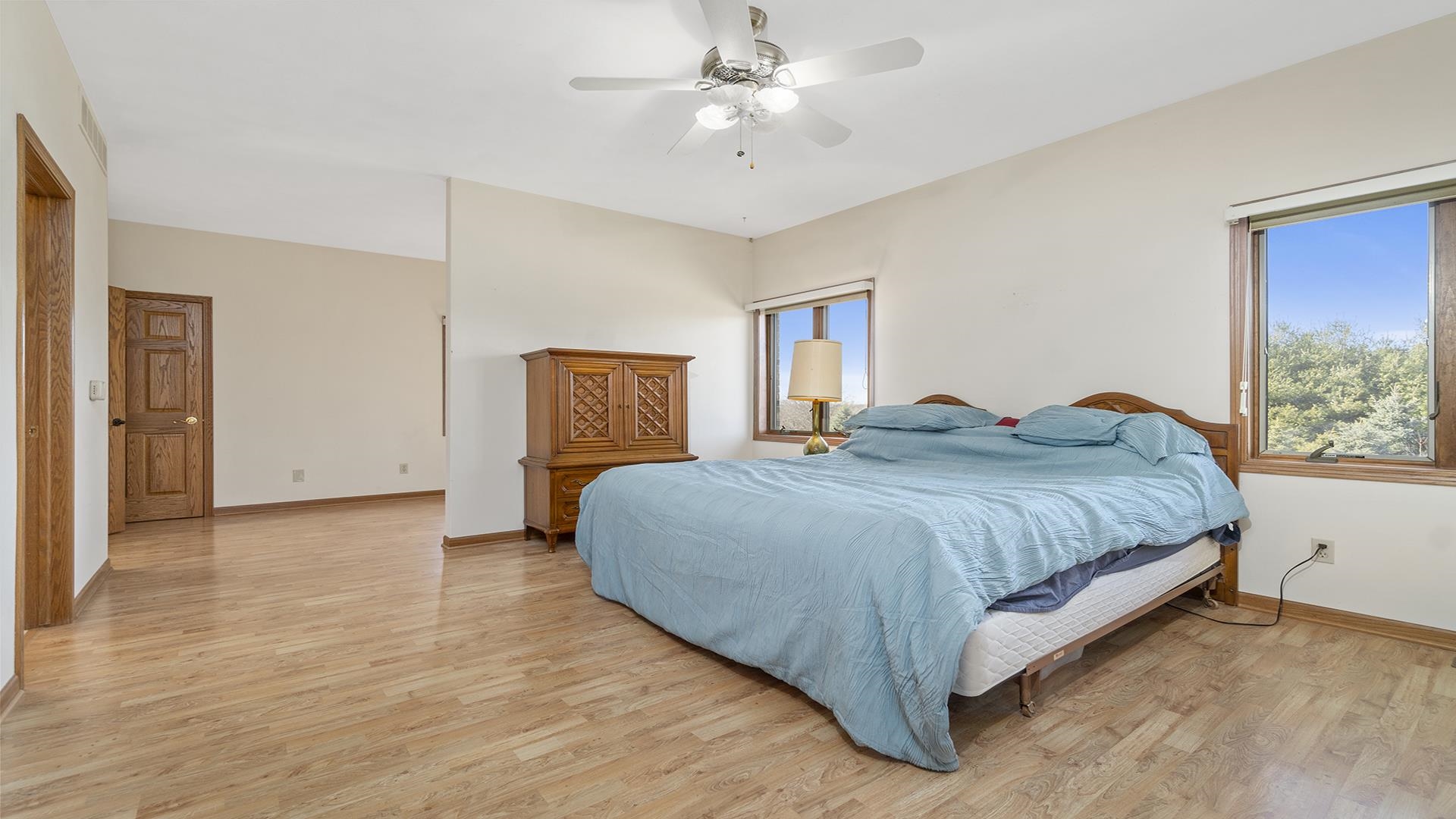 7674 West Pines Road Polo, IL 61064 - Photo 32 of 60 a spacious bedroom with a bed and a window