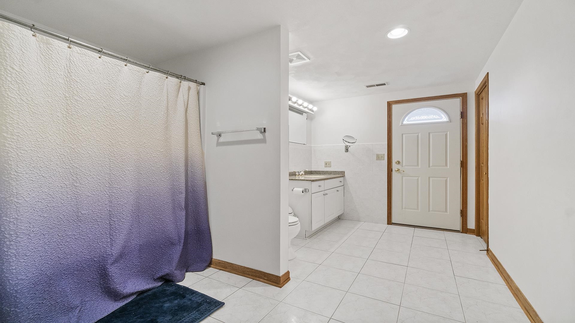 7674 West Pines Road Polo, IL 61064 - Photo 41 of 60 a view of a bathroom with a sink and a mirror