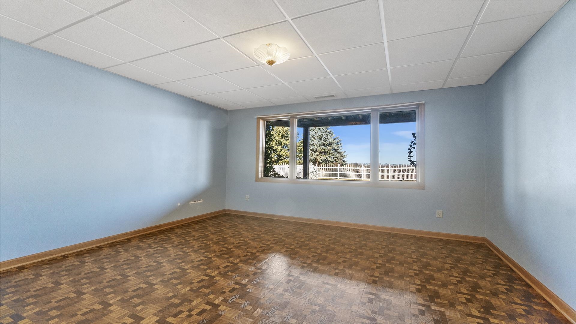 7674 West Pines Road Polo, IL 61064 - Photo 45 of 60 an empty room with wooden floor and windows