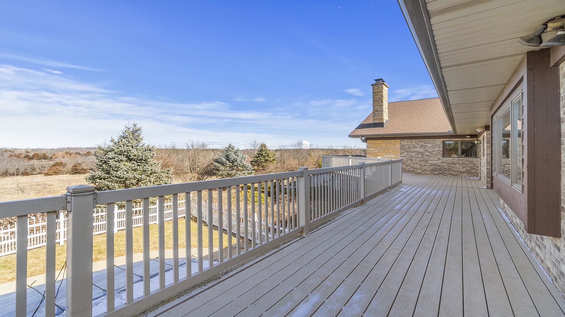 7674 West Pines Road Polo, IL 61064 - Photo 48 of 60 a view of balcony with wooden floor and fence
