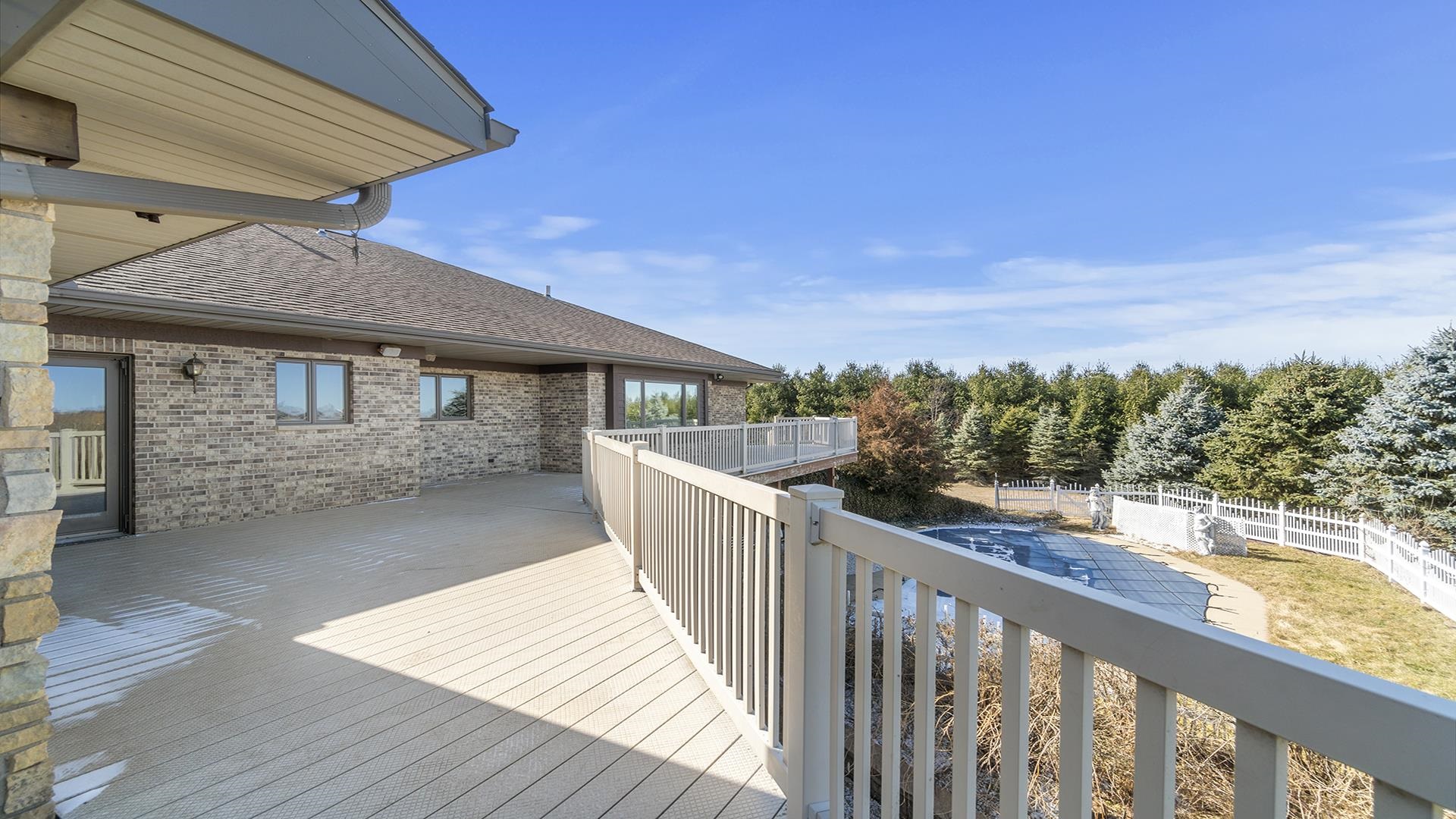 7674 West Pines Road Polo, IL 61064 - Photo 49 of 60 a view of a wooden deck and a backyard