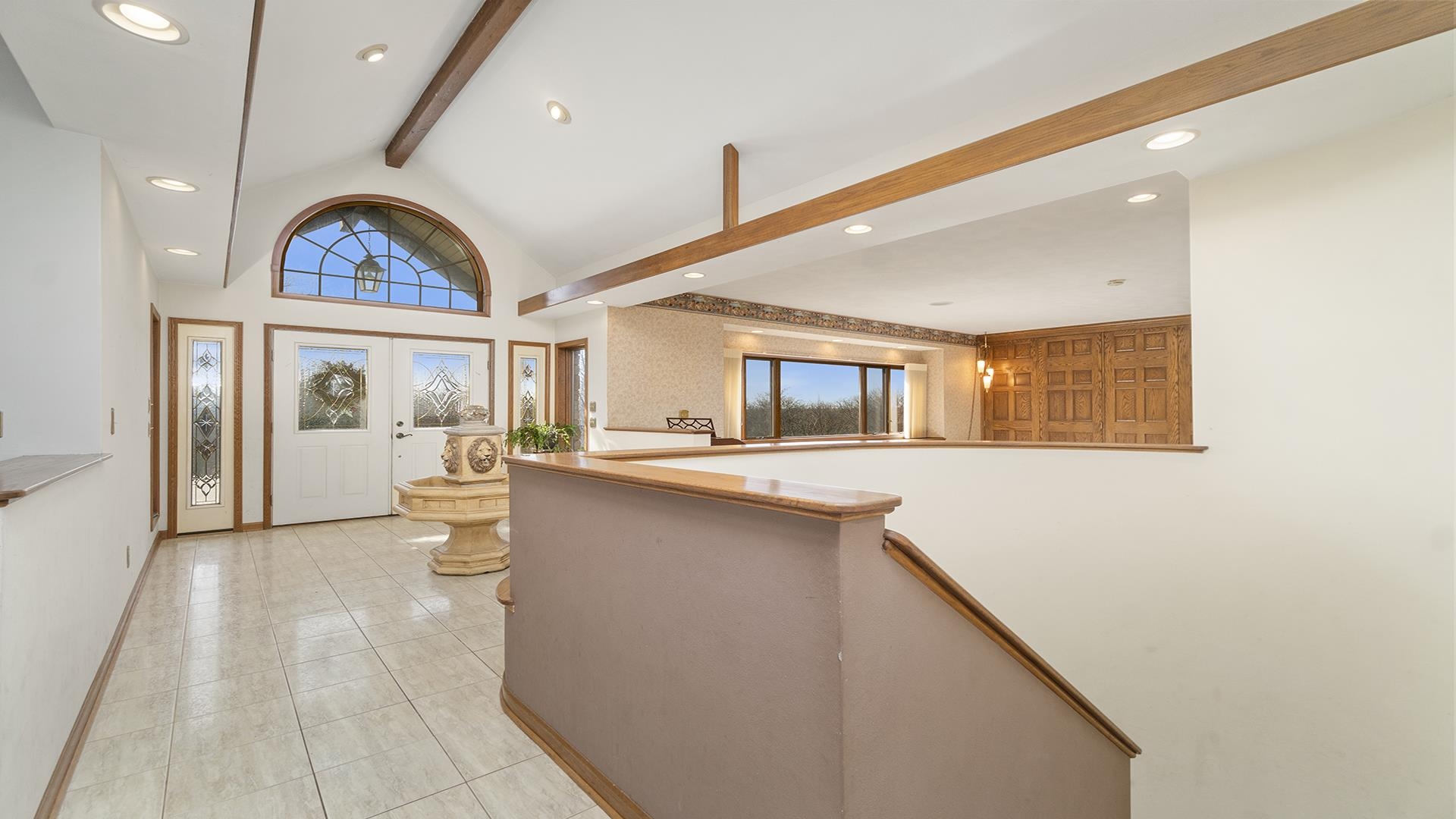 7674 West Pines Road Polo, IL 61064 - Photo 5 of 60 a view of living room with kitchen island stainless steel appliances wooden floor and window