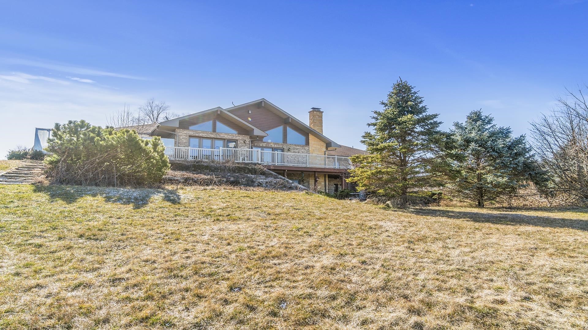 7674 West Pines Road Polo, IL 61064 - Photo 51 of 60 a front view of a house with a yard
