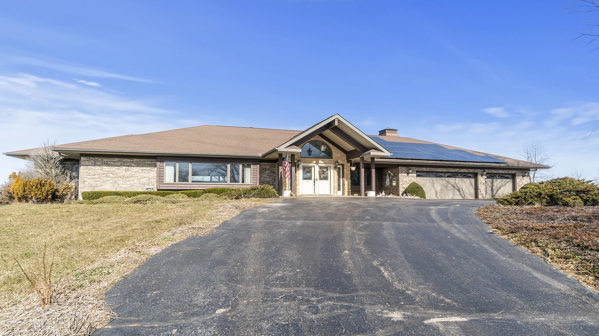 7674 West Pines Road Polo, IL 61064 - Photo 52 of 60 a front view of a house with a yard