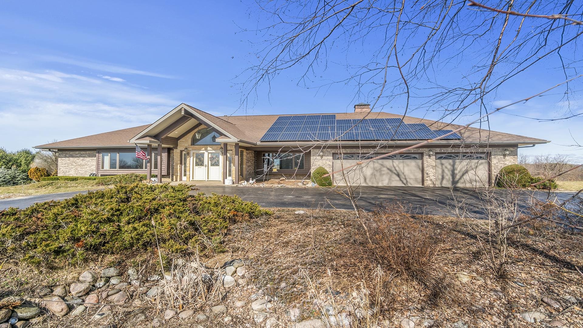 7674 West Pines Road Polo, IL 61064 - Photo 54 of 60 a front view of a house with a garden