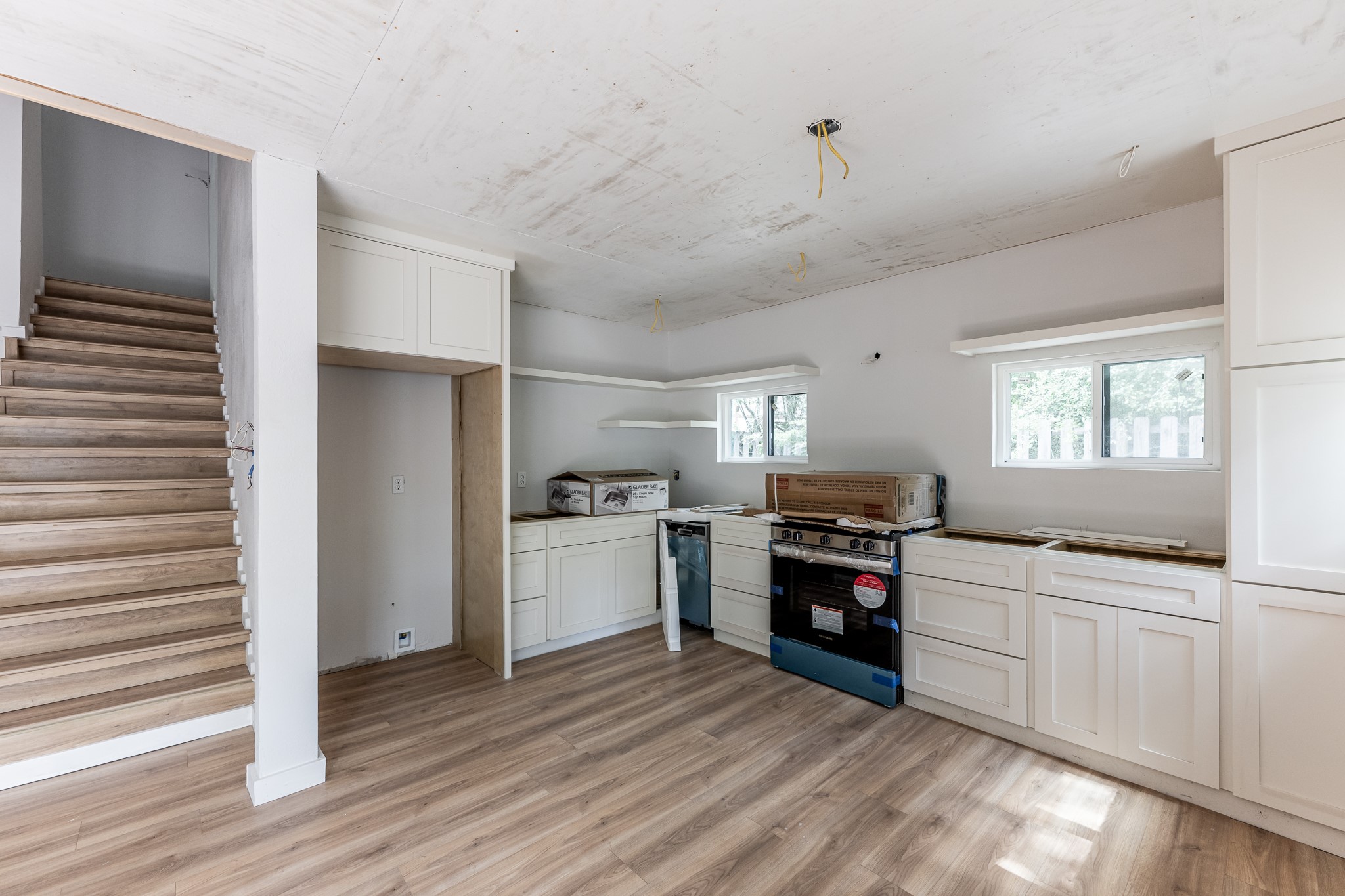 28600 Rantoul Court Point Blank, TX 77364 - Photo 16 of 33 a kitchen with a refrigerator and a stove top oven