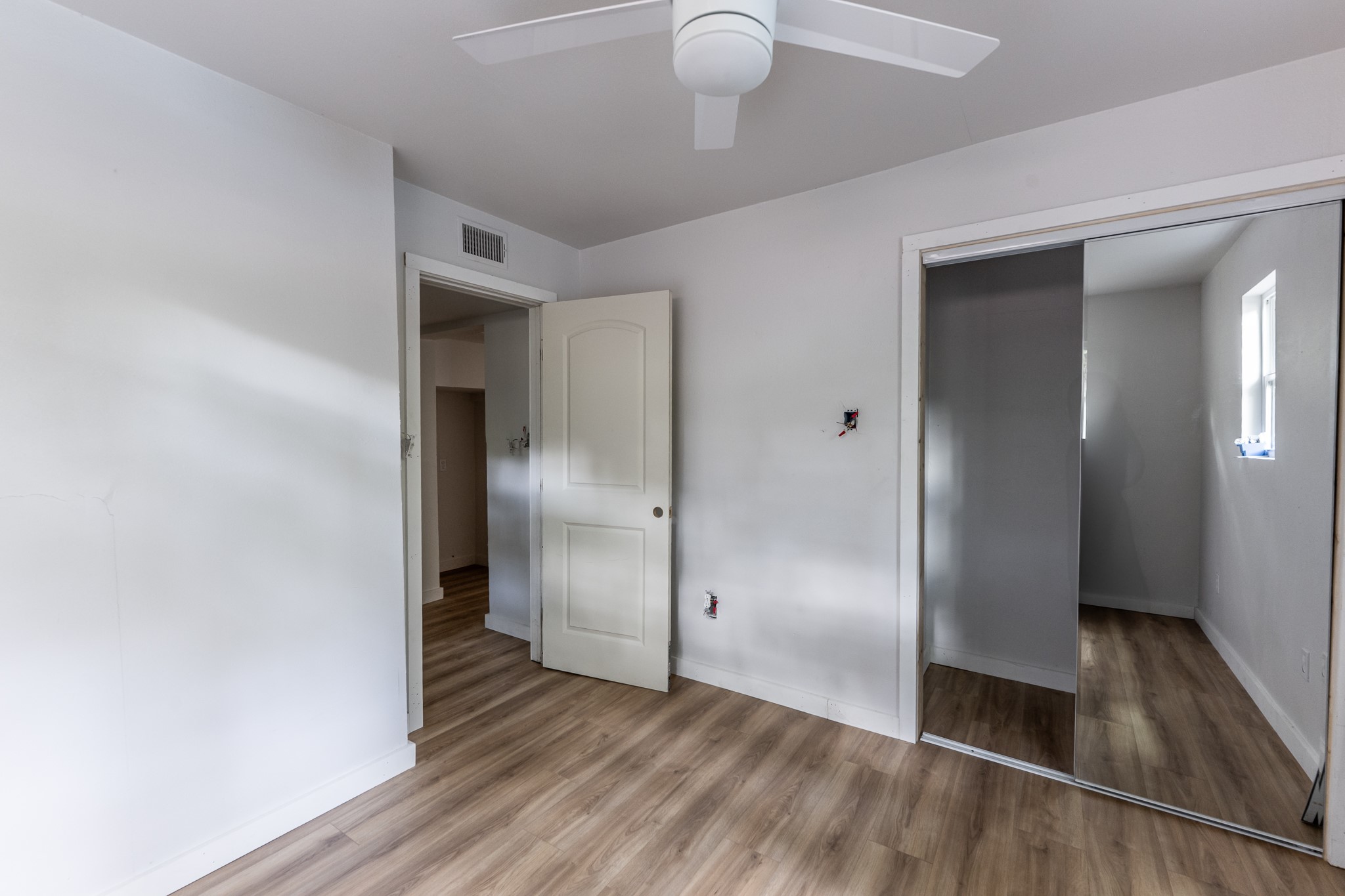 28600 Rantoul Court Point Blank, TX 77364 - Photo 23 of 33 a view of a hallway with wooden floor
