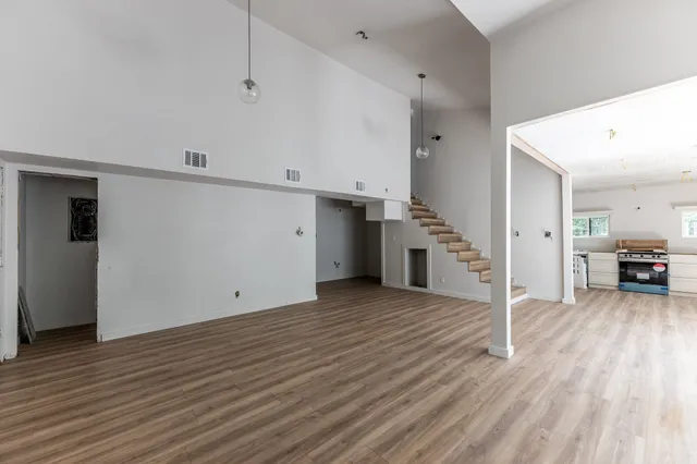 a view of a livingroom with wooden floor