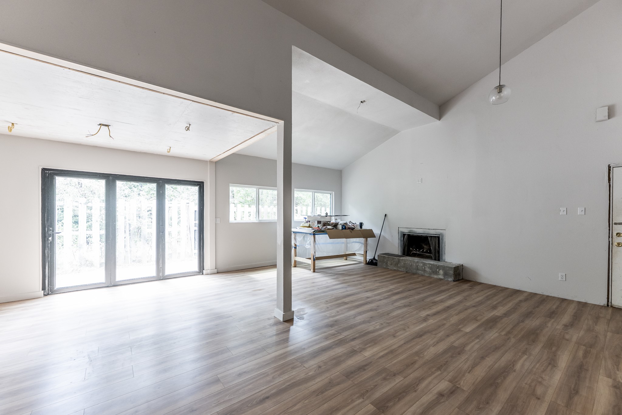 28600 Rantoul Court Point Blank, TX 77364 - Photo 9 of 33 a view of an empty room with a window and wooden floor