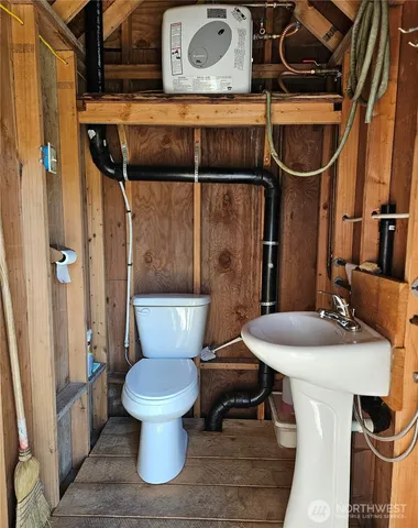 a bathroom with a toilet and a sink