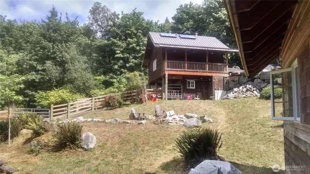a backyard of a house with lots of green space