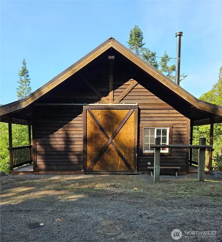 a front view of a house with wooden fence