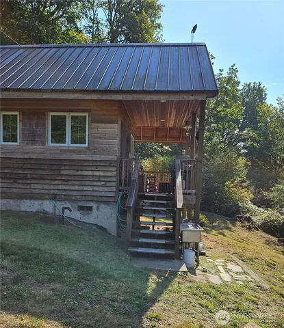 a backyard of a house with barbeque oven