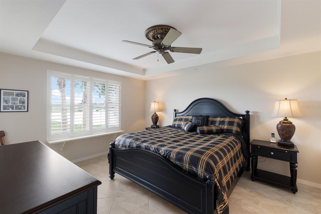 7179 Boca Grove Place, Unit 202 Lakewood Ranch, FL 34202 - Photo 20 of 46 a bedroom with a bed and window