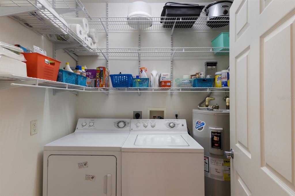 7179 Boca Grove Place, Unit 202 Lakewood Ranch, FL 34202 - Photo 28 of 46 a utility room with dryer and washer