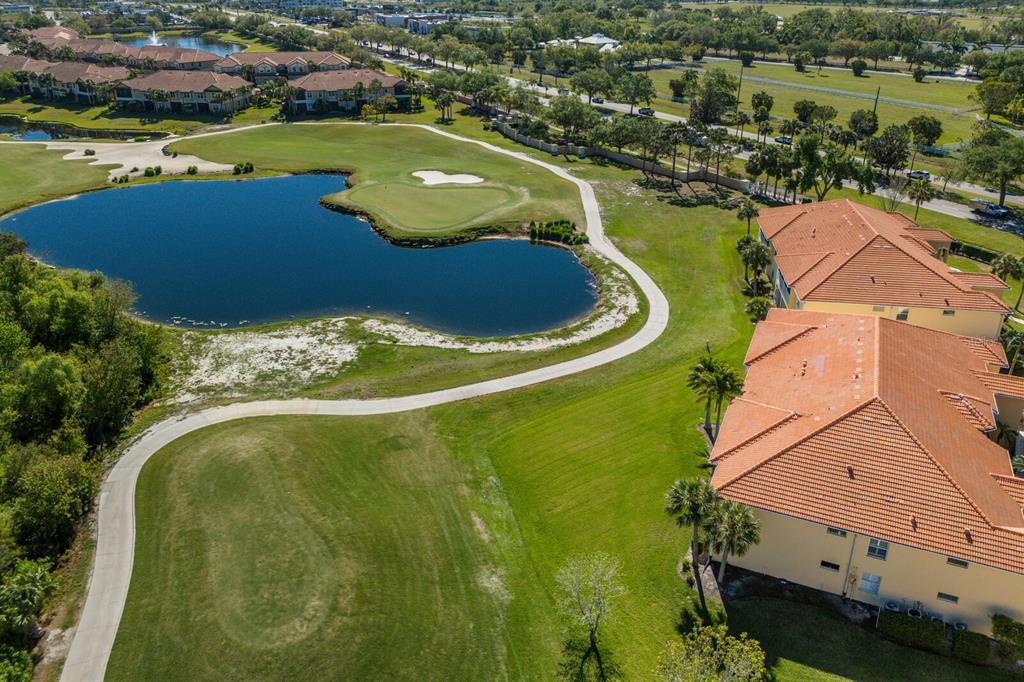 7179 Boca Grove Place, Unit 202 Lakewood Ranch, FL 34202 - Photo 30 of 46 an aerial view of residential houses with outdoor space and swimming pool
