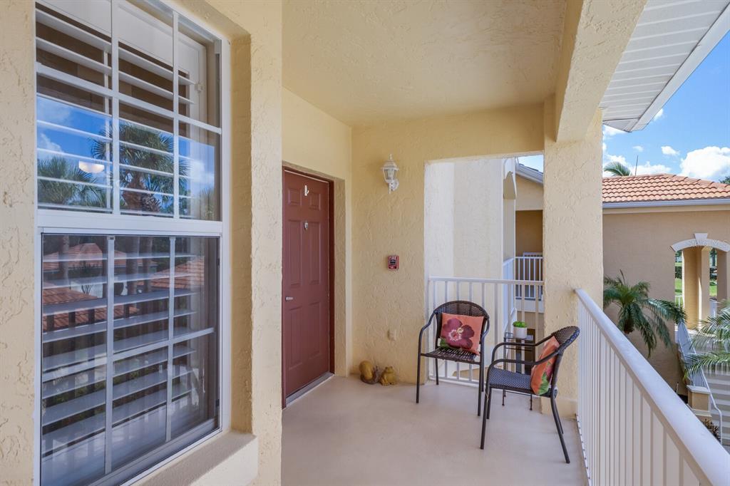 7179 Boca Grove Place, Unit 202 Lakewood Ranch, FL 34202 - Photo 3 of 46 a view of living room with furniture and window