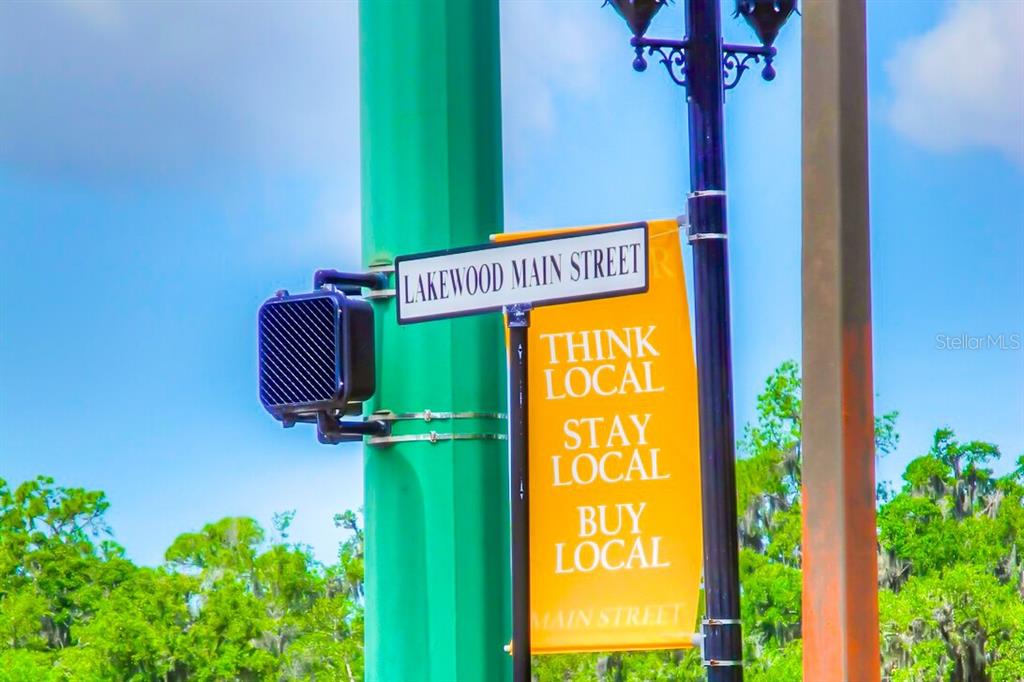 7179 Boca Grove Place, Unit 202 Lakewood Ranch, FL 34202 - Photo 40 of 46 a view of front door with yellow