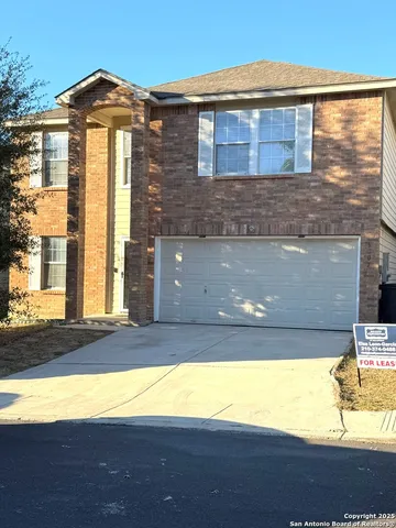 a view of house with yard