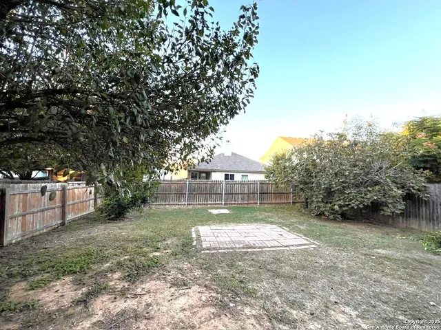 a view of house with a yard