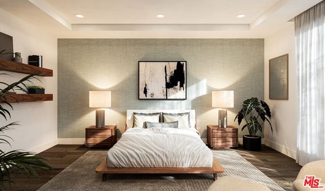 a bedroom with a bed and a mirror